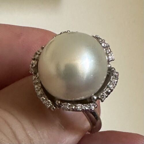 An Immense 14.3mm South Sea cultured pearl diamond platinum ring