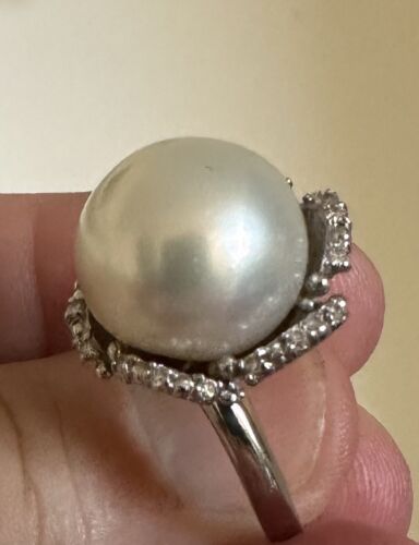 An Immense 14.3mm South Sea cultured pearl diamond platinum ring