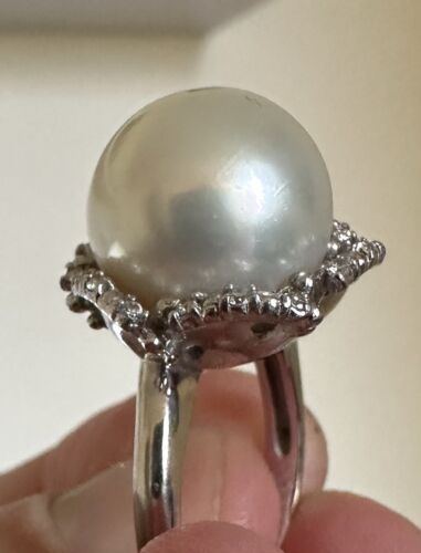 An Immense 14.3mm South Sea cultured pearl diamond platinum ring