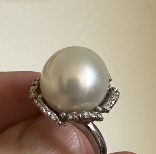 An Immense 14.3mm South Sea cultured pearl diamond platinum ring