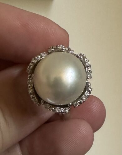 An Immense 14.3mm South Sea cultured pearl diamond platinum ring