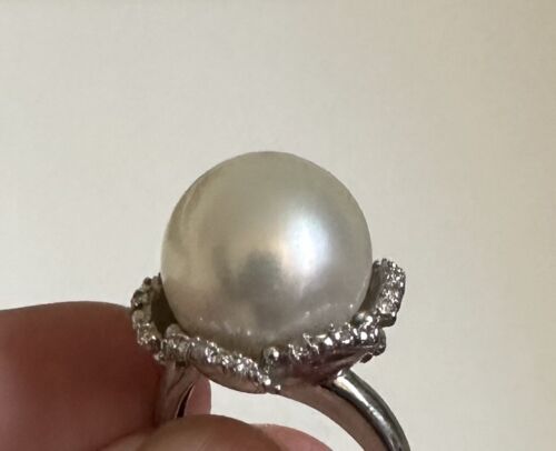 An Immense 14.3mm South Sea cultured pearl diamond platinum ring