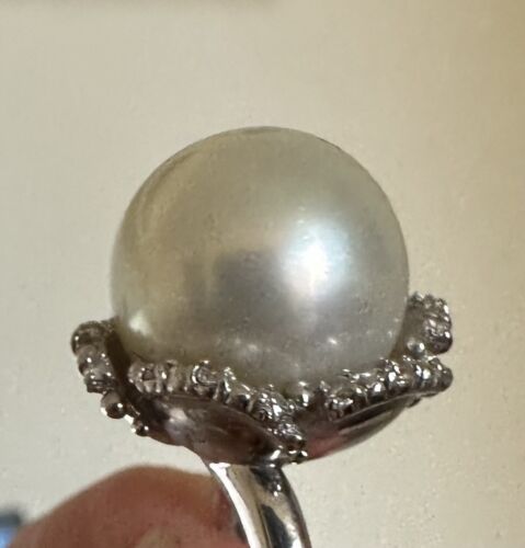 An Immense 14.3mm South Sea cultured pearl diamond platinum ring