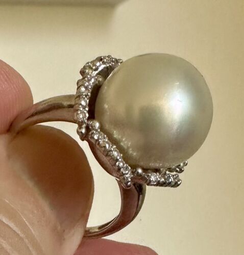 An Immense 14.3mm South Sea cultured pearl diamond platinum ring