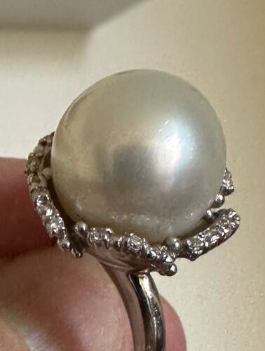 An Immense 14.3mm South Sea cultured pearl diamond platinum ring