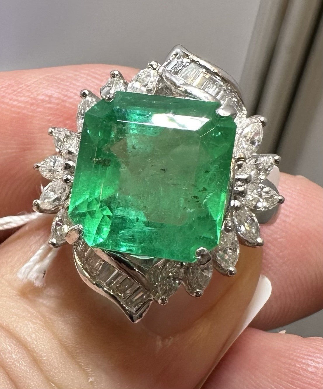 A Wonderful 6.76ct Colombia Emerald & Diamond Ring