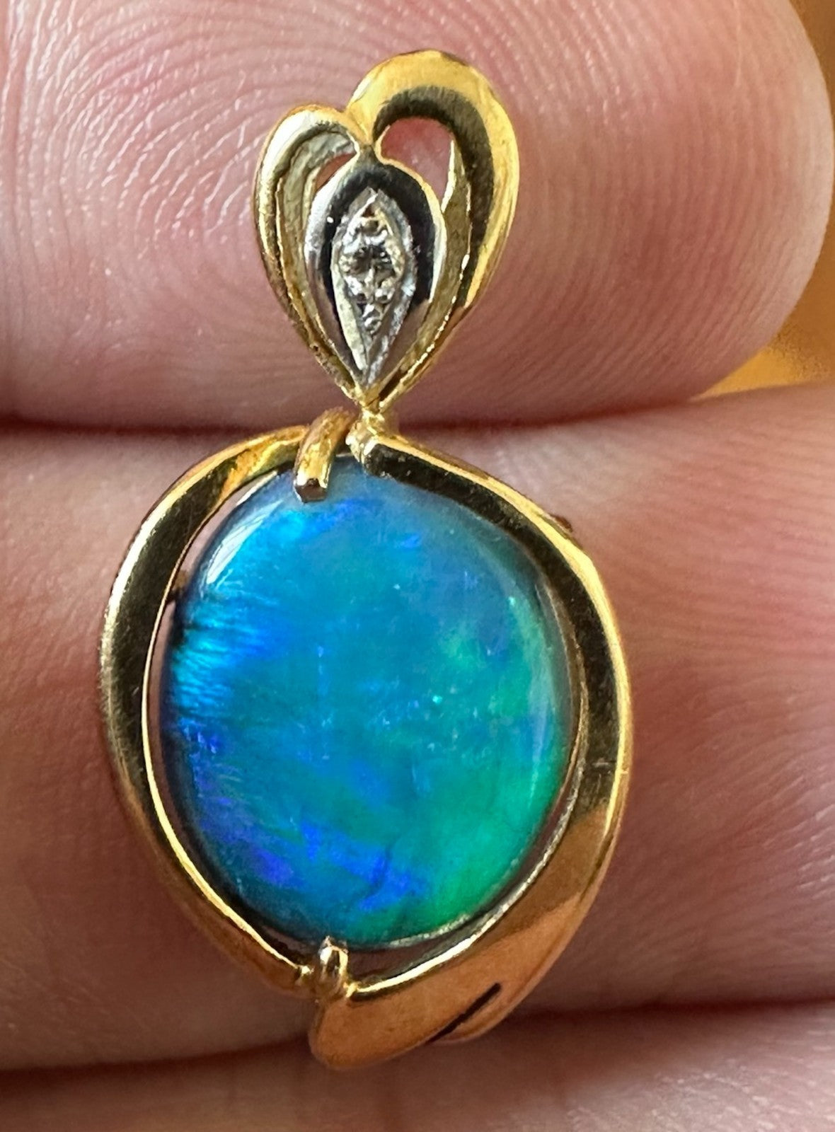 An Exquisite Australian Black Opal & Diamond 18k Pendant