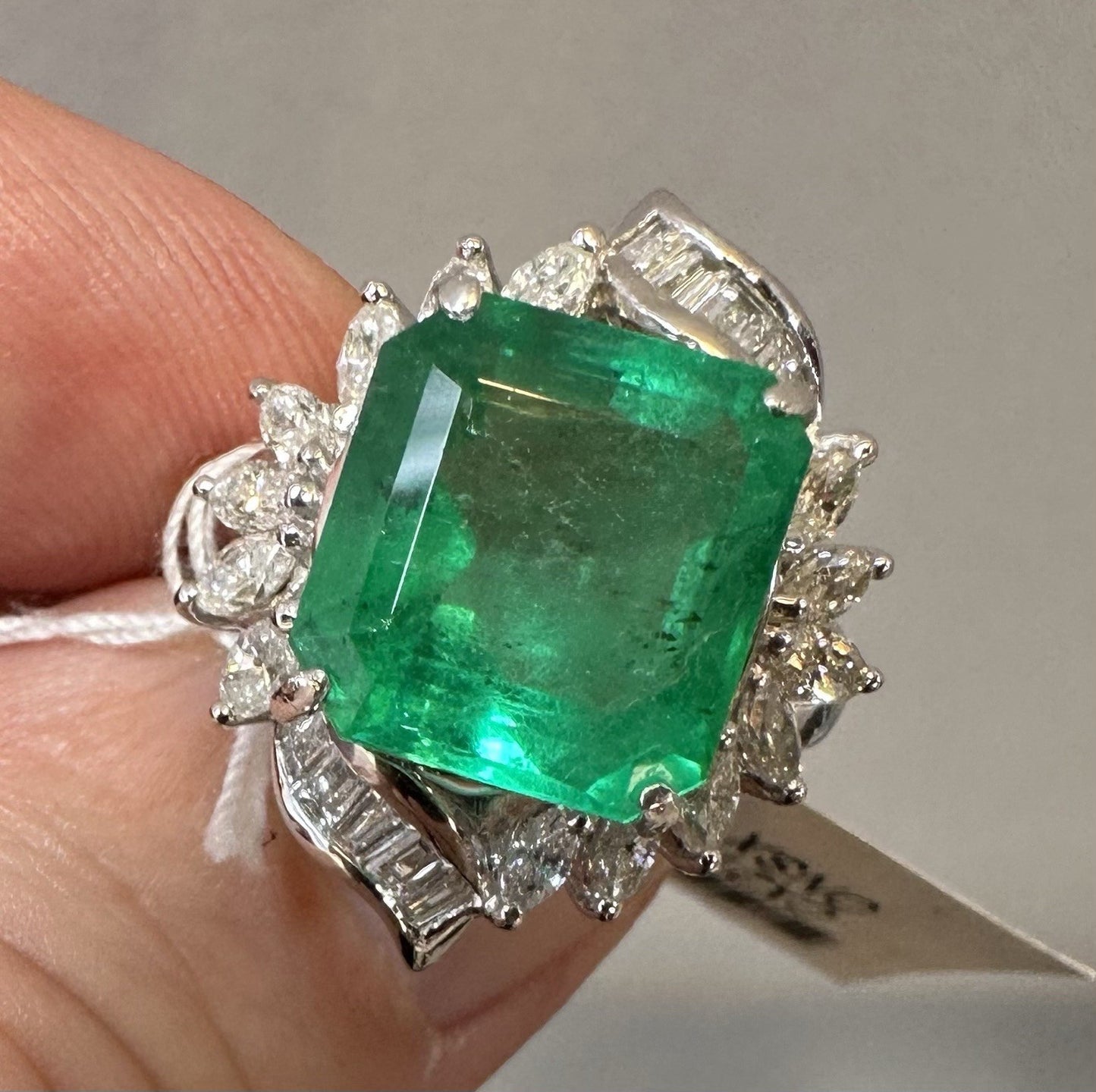 A Wonderful 6.76ct Colombia Emerald & Diamond Ring