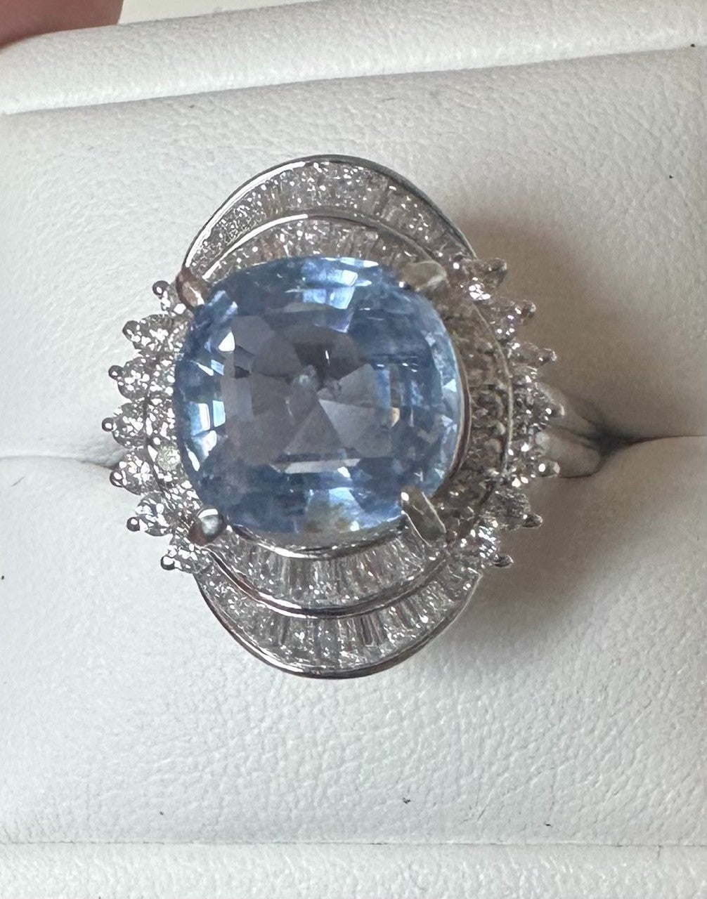 An Impressive Unheated 7.52ct Light Blue Sapphire Platinum & Diamond Ring