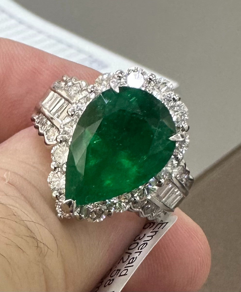 A Superb 6.30ct Muzo Colombia Emerald & Diamond Ring